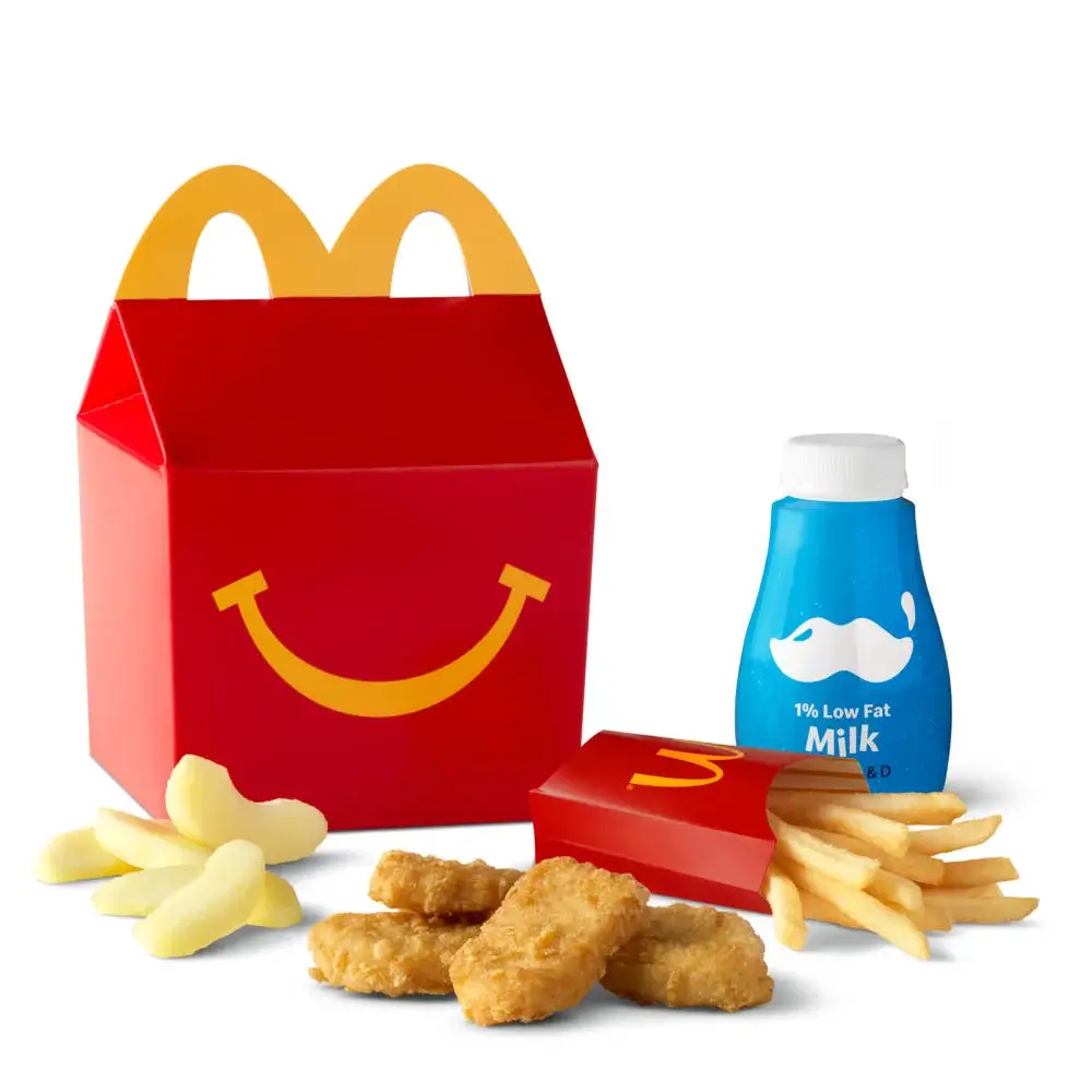 Four Chicken McNuggets®, fries, and a drink in a Happy Meal® box.