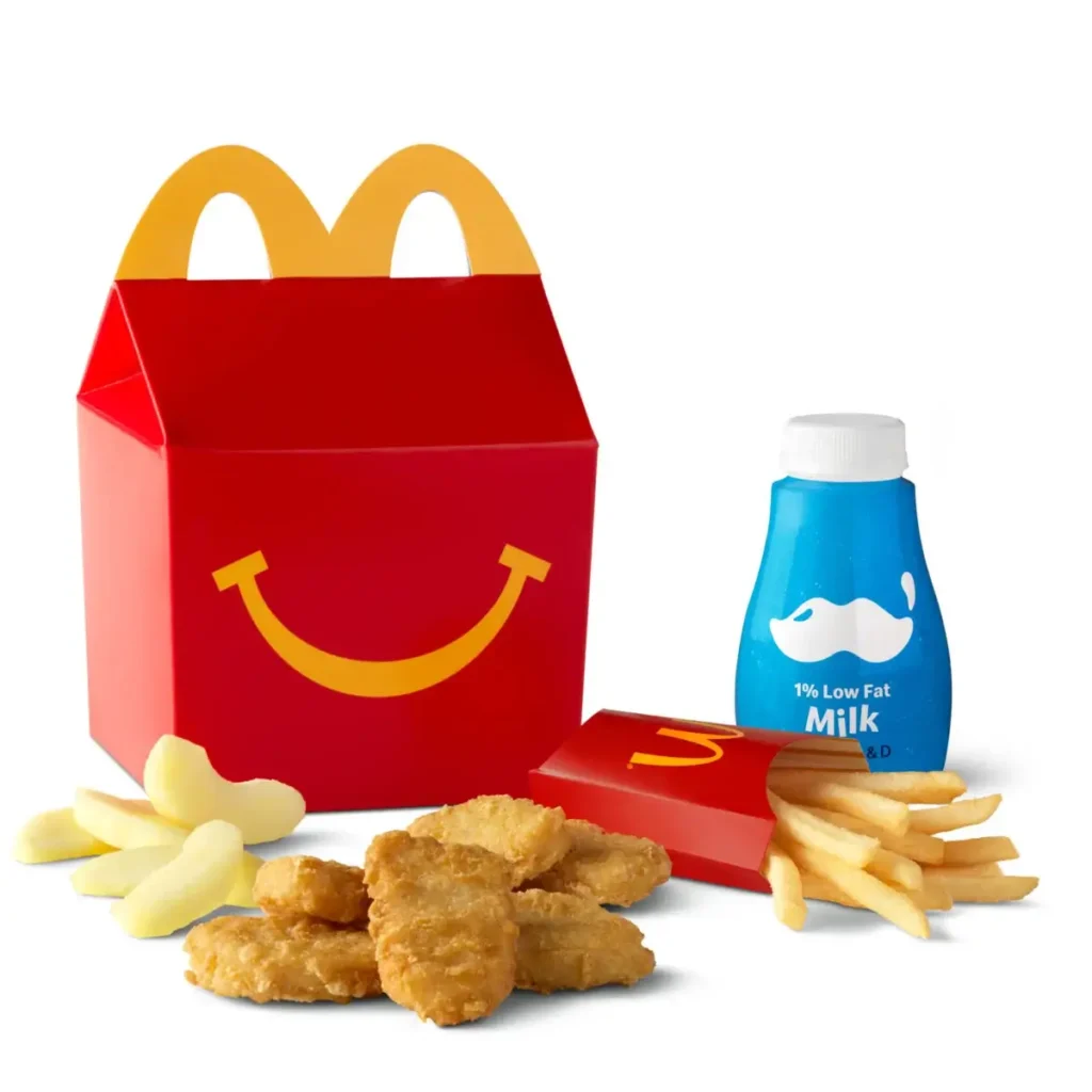 Six Chicken McNuggets®, fries, and a drink in a Happy Meal® box.