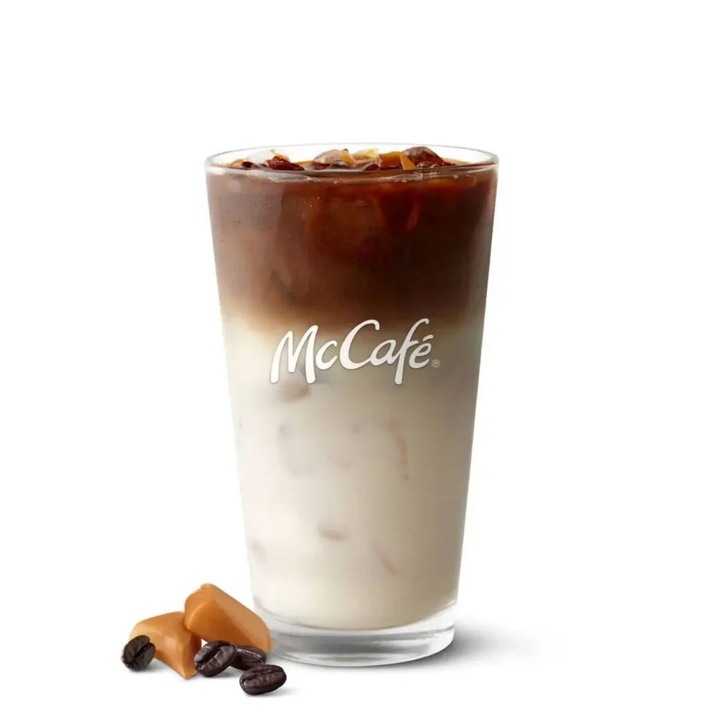 Iced caramel macchiato with espresso and milk in a cup.