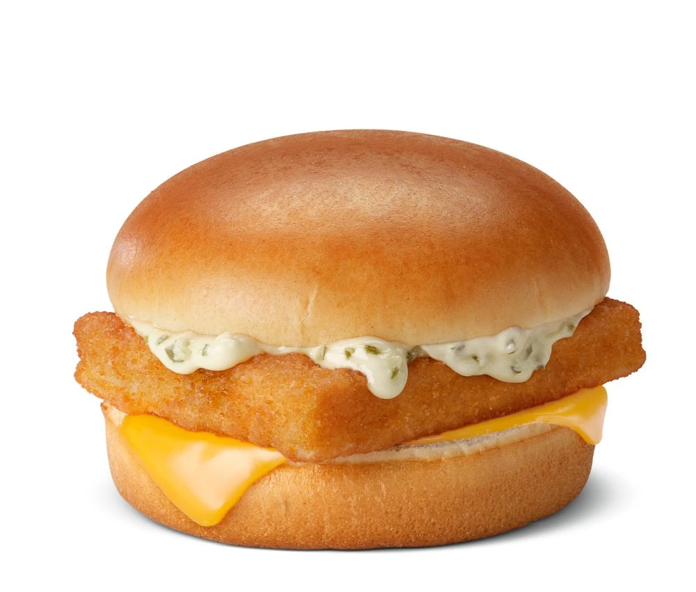 Crispy fish filet sandwich with tartar sauce on a steamed bun.