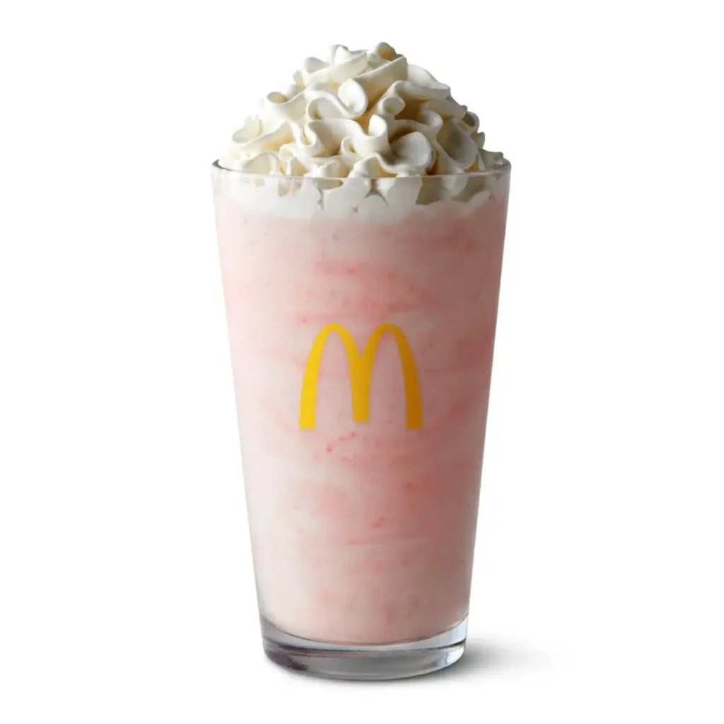 Thick strawberry shake with whipped cream topping.